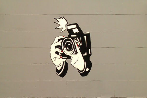 street art of a camera taking a photo