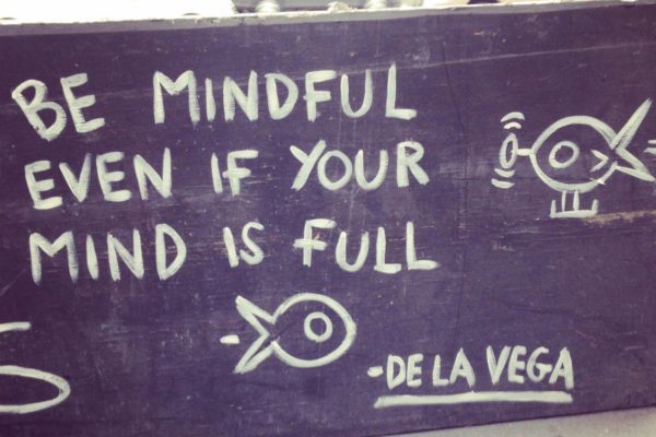 De la Vega street art that reads Be Mindful Even If Your Mind Is Full